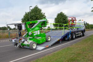 Loading and un-loading a MEWP on a beavertail truck