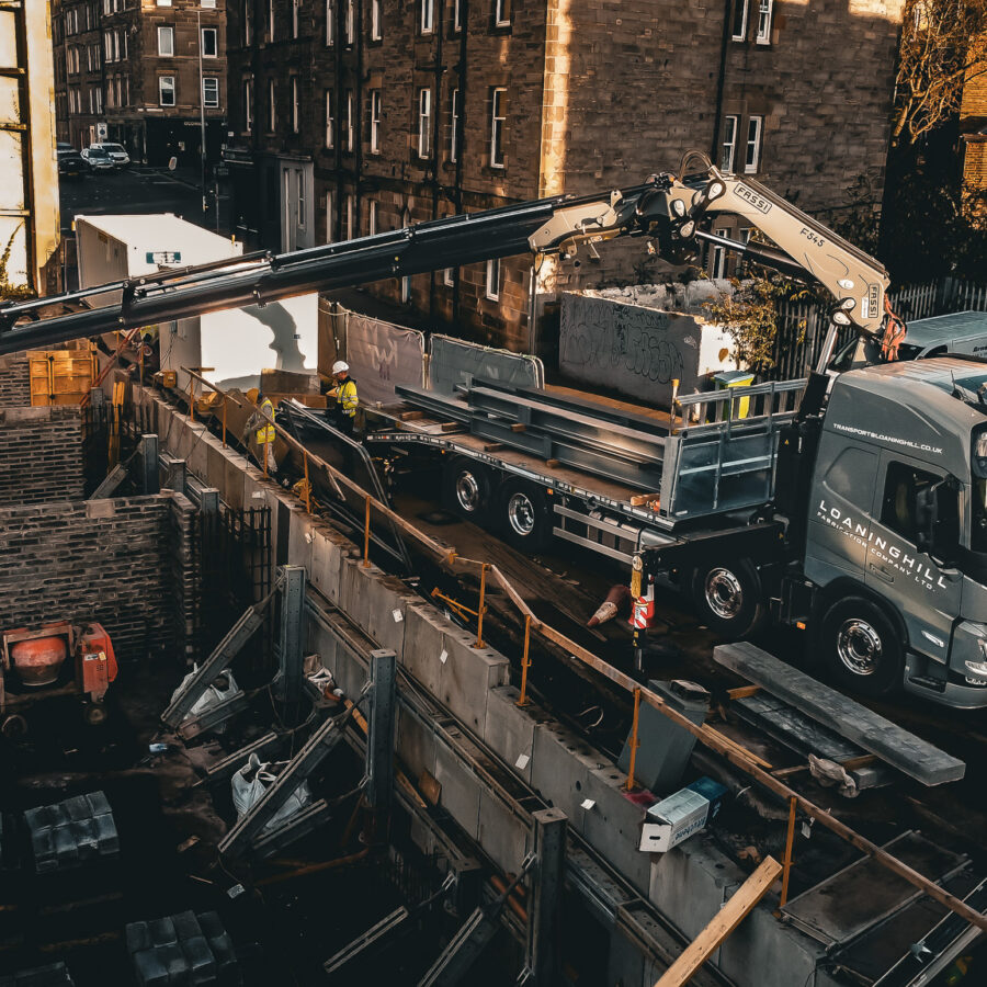 A Sterling beavertail plant body truck mounted on the bed is a Fassi Crane